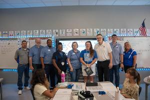 TISD administrators recognize a TIA recipient at Sampson-Howard Elementary