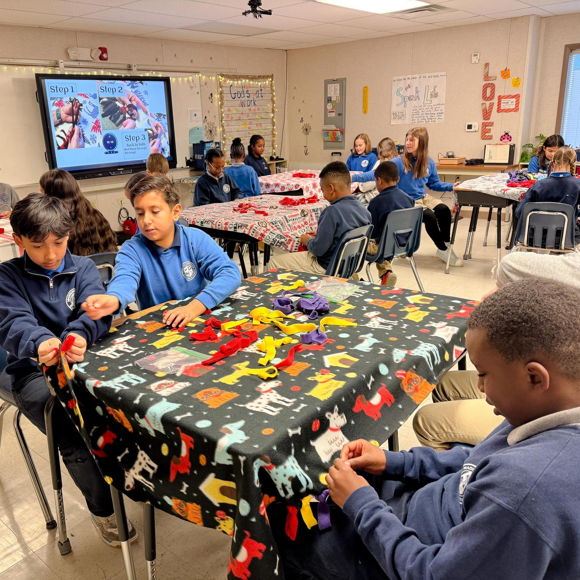 Students making blankets