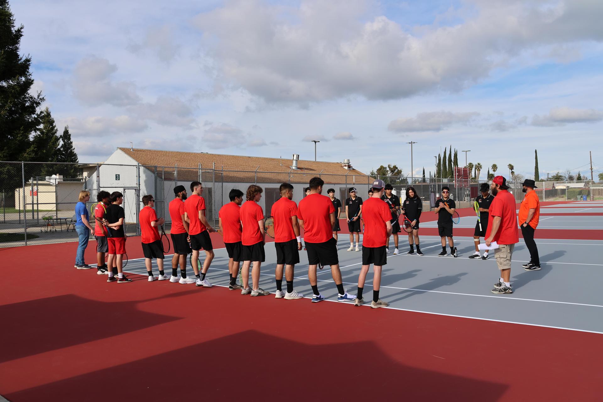 CUHS Boys playing tennis against coalinga