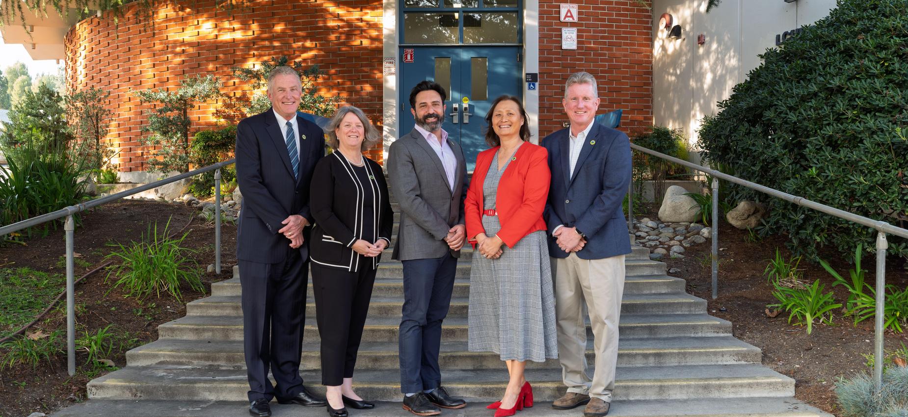 LCUSD Governing Board Members on stairs in front of Governing Board room at LCUSD District Office.