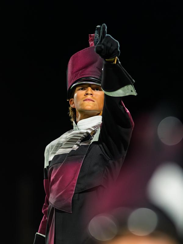 Action photo of Davenport High School senior Caleb Atkins during a band performance.