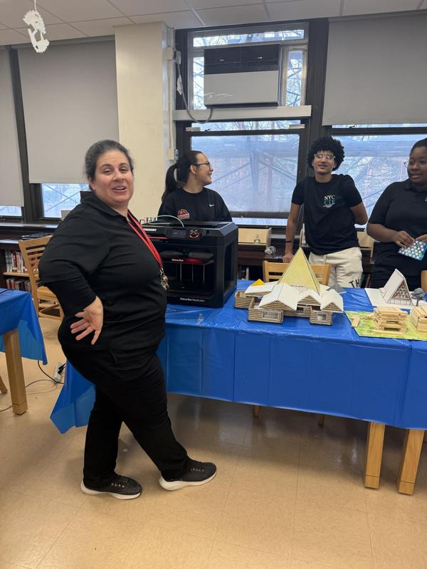 a teacher at a table during the event