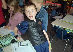 Students completing reading and math activities.