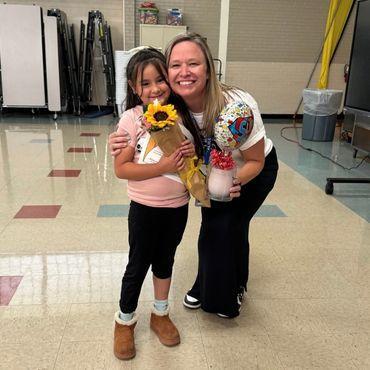 teacher hugging student
