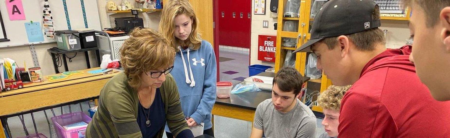 Mrs. Lovria with students