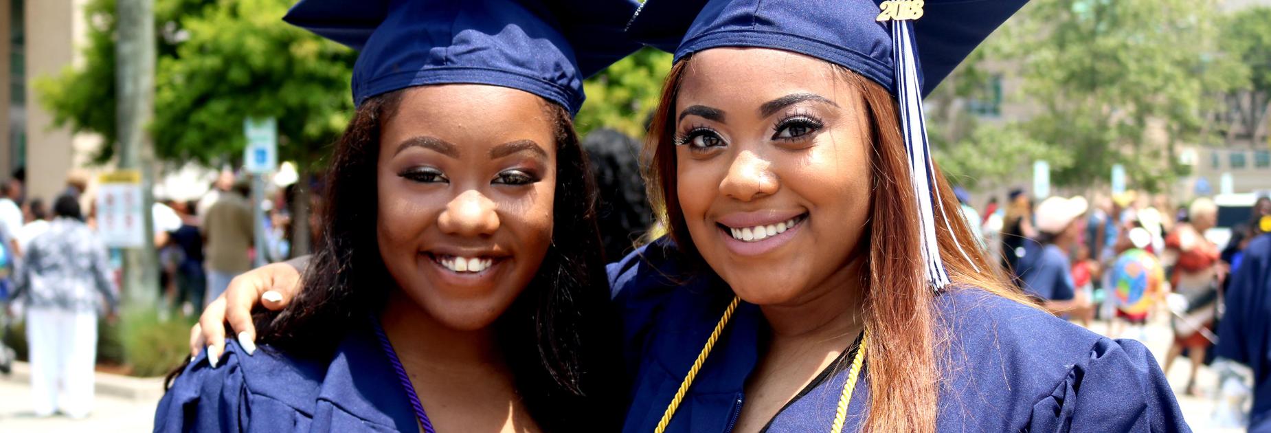 2 female class of 2018 KRHS graduates hugging
