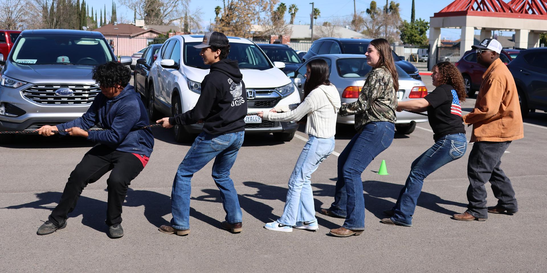 students and staff enjoying the truck pull