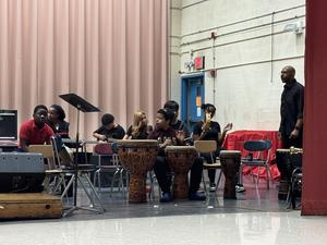 Our seniors is playing the drums