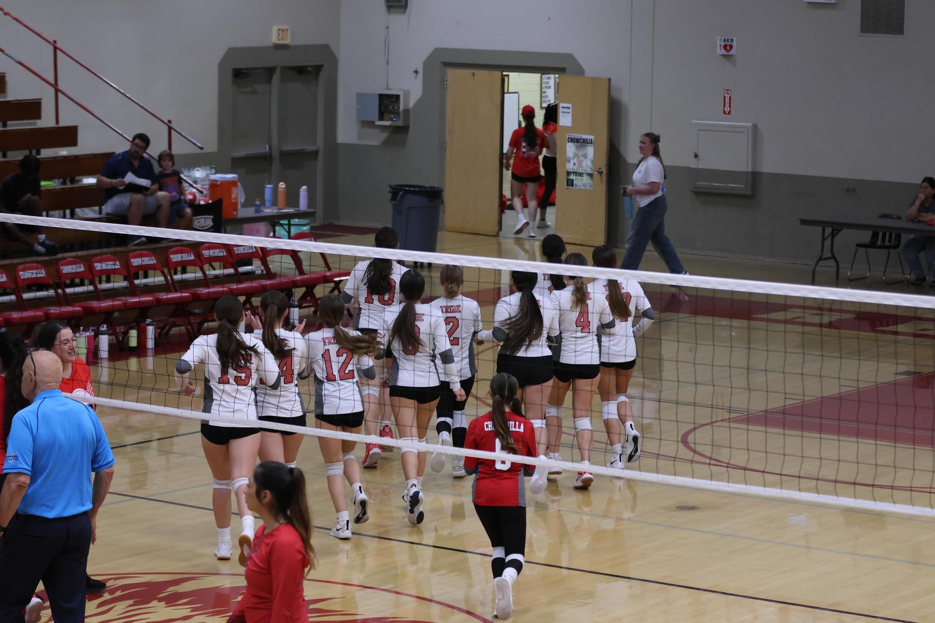 junior varsity girls playing volleyball 139