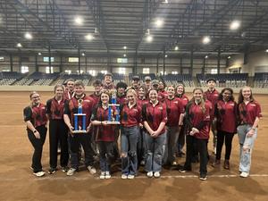 Archery team holding trophy