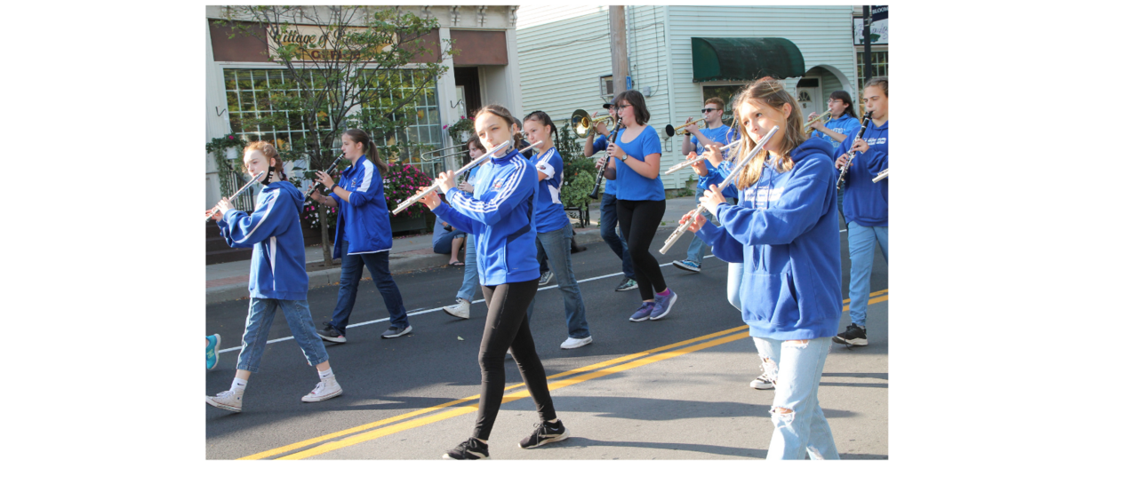 students marching playing flutes