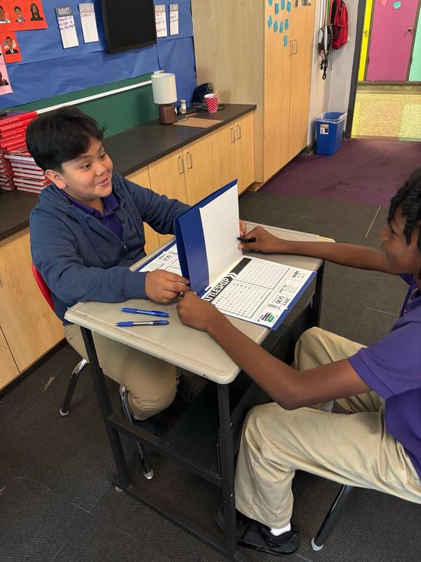 Two scholars playing battleship