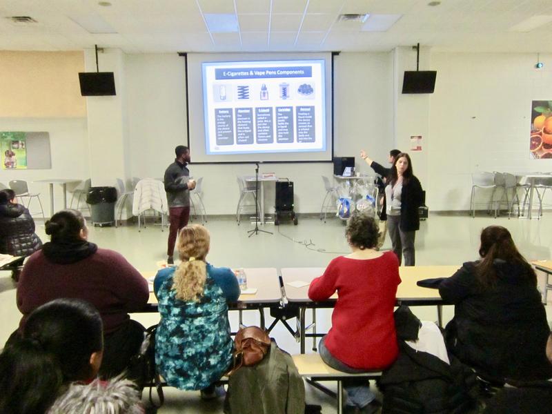 Parent Liaison Mendez and others giving parents information about vaping