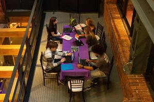 A distant overhead view of students at a table