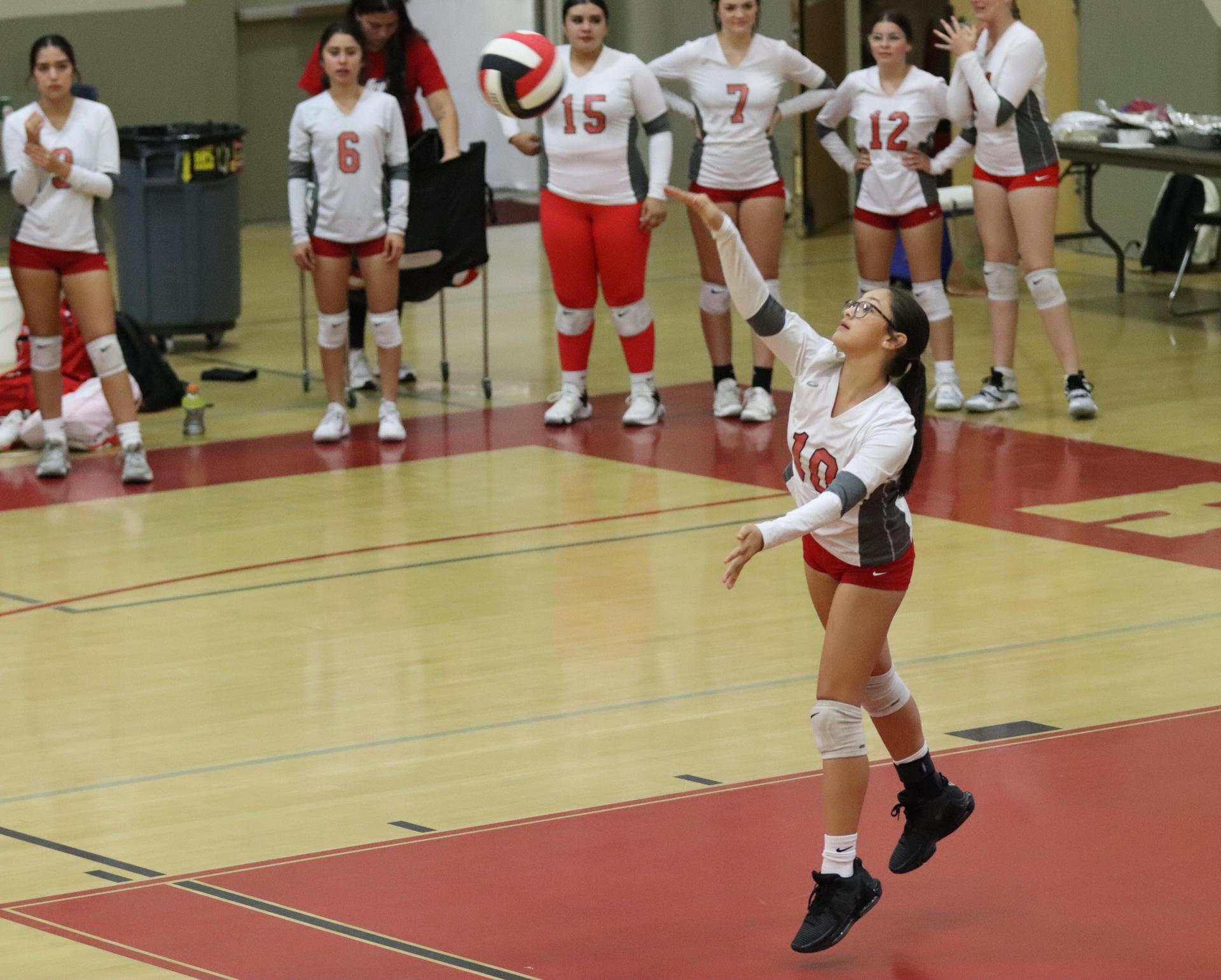 junior varsity girls playing volleyball against Liberty