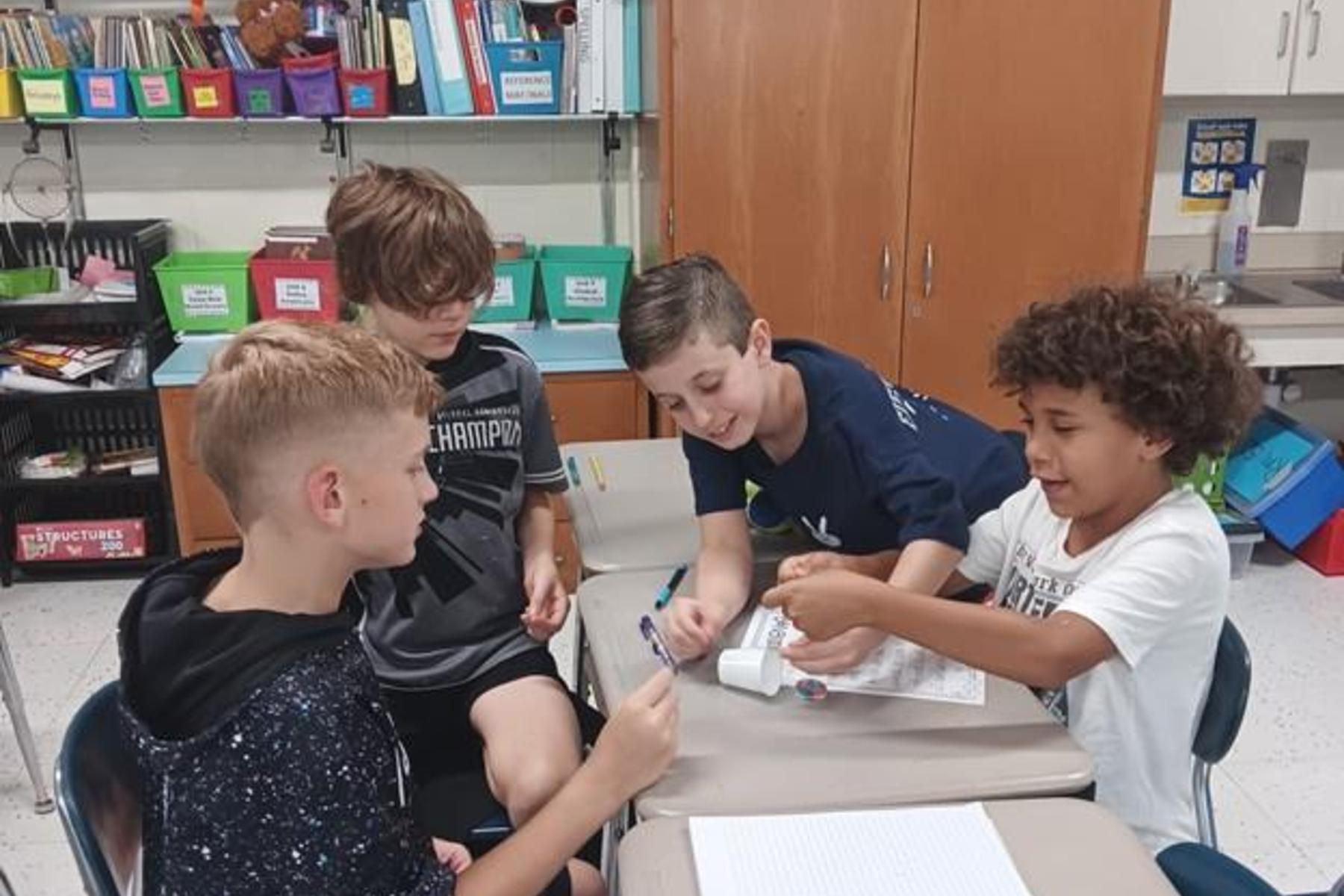 5th graders working