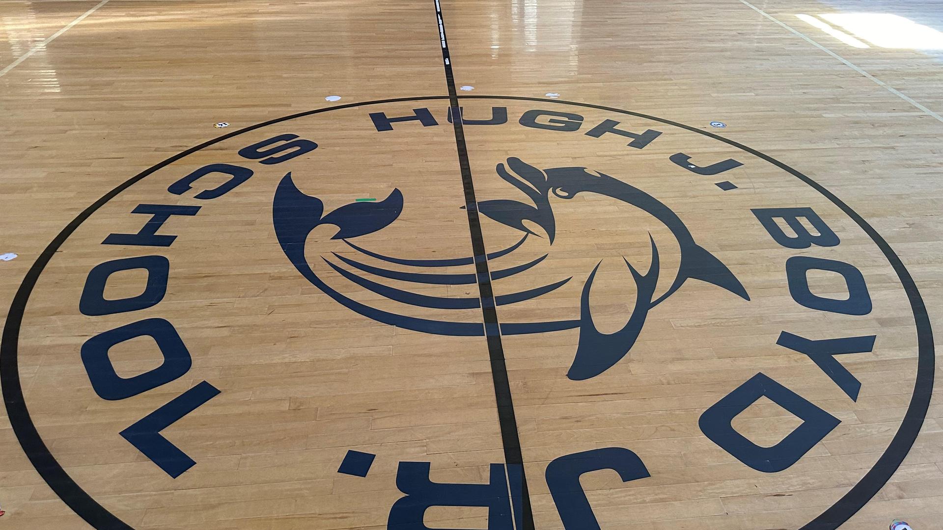 Floor design featuring the logo of Hugh J. Boyd Jr. School with a fish emblem.