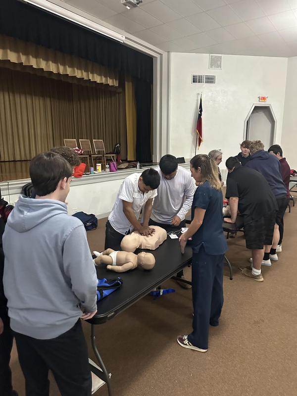 Senior students learning CPR.