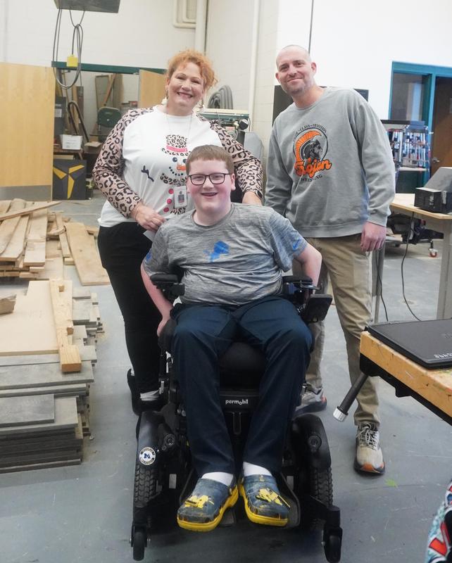 Kristi Palmbos and Dayne Fletke stand beside Nate Boersma.
