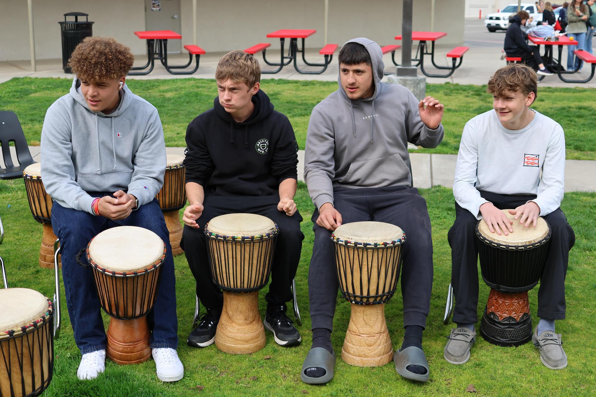 students and staff participating with the African Drum Interactive