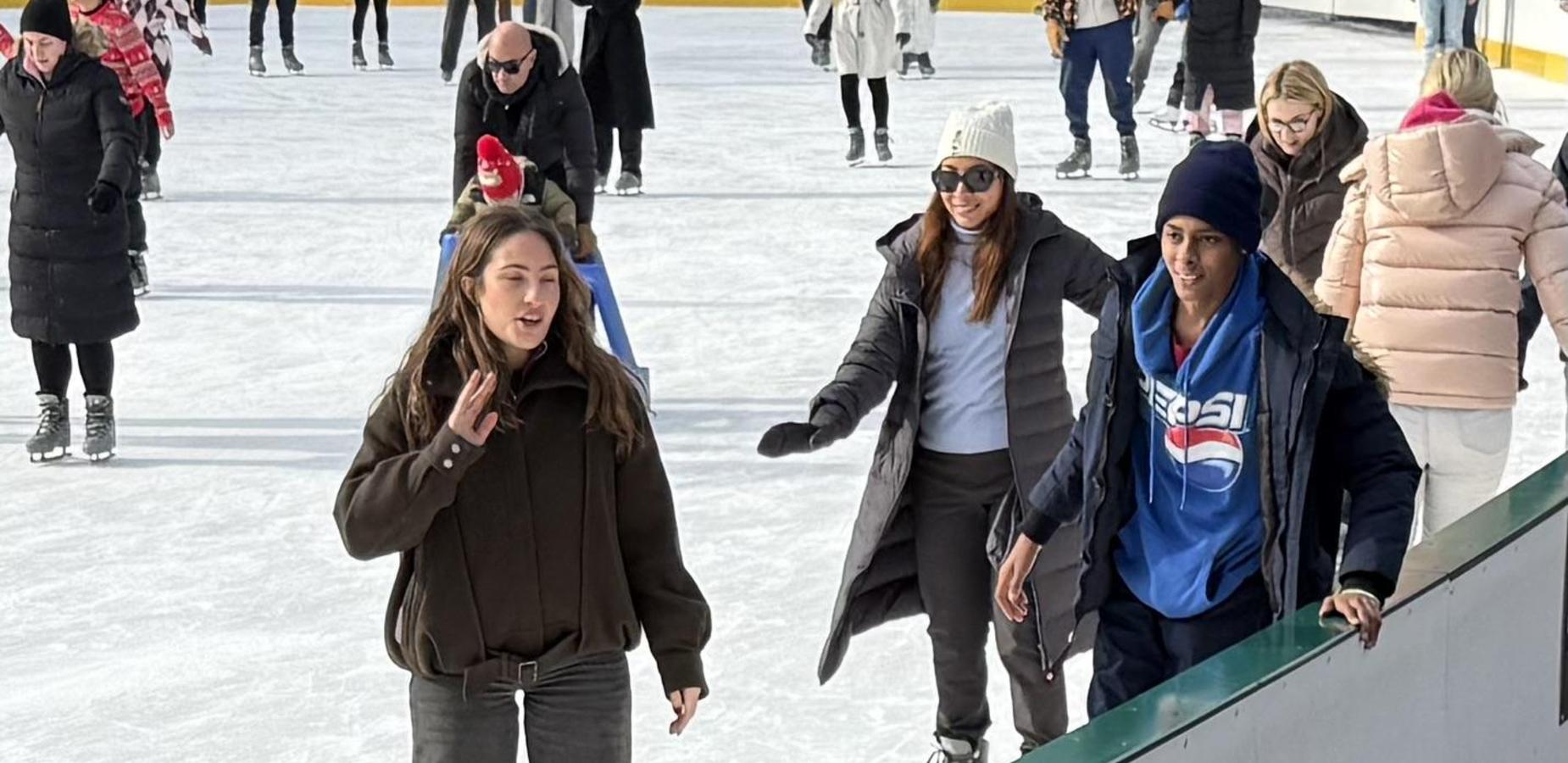 Student and chaperone ice skating