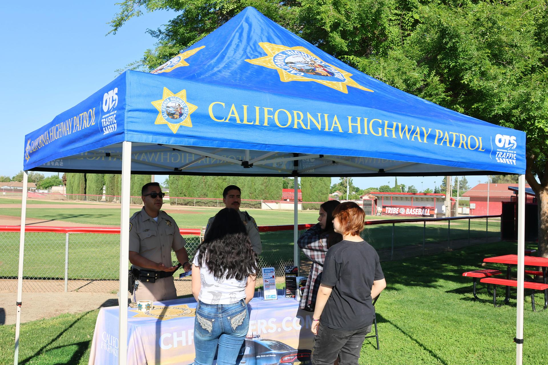 Highway patrol officers speaking to students