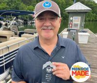 Doug Patterson with trophy Monroe Made Alumni Spotlight