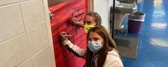 Students working on Christmas door decorations