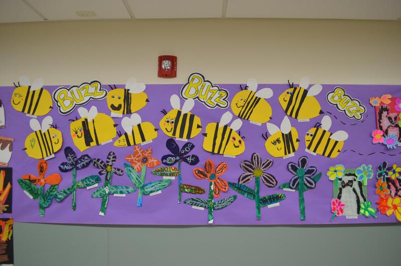 elementary students artwork of bee flowers