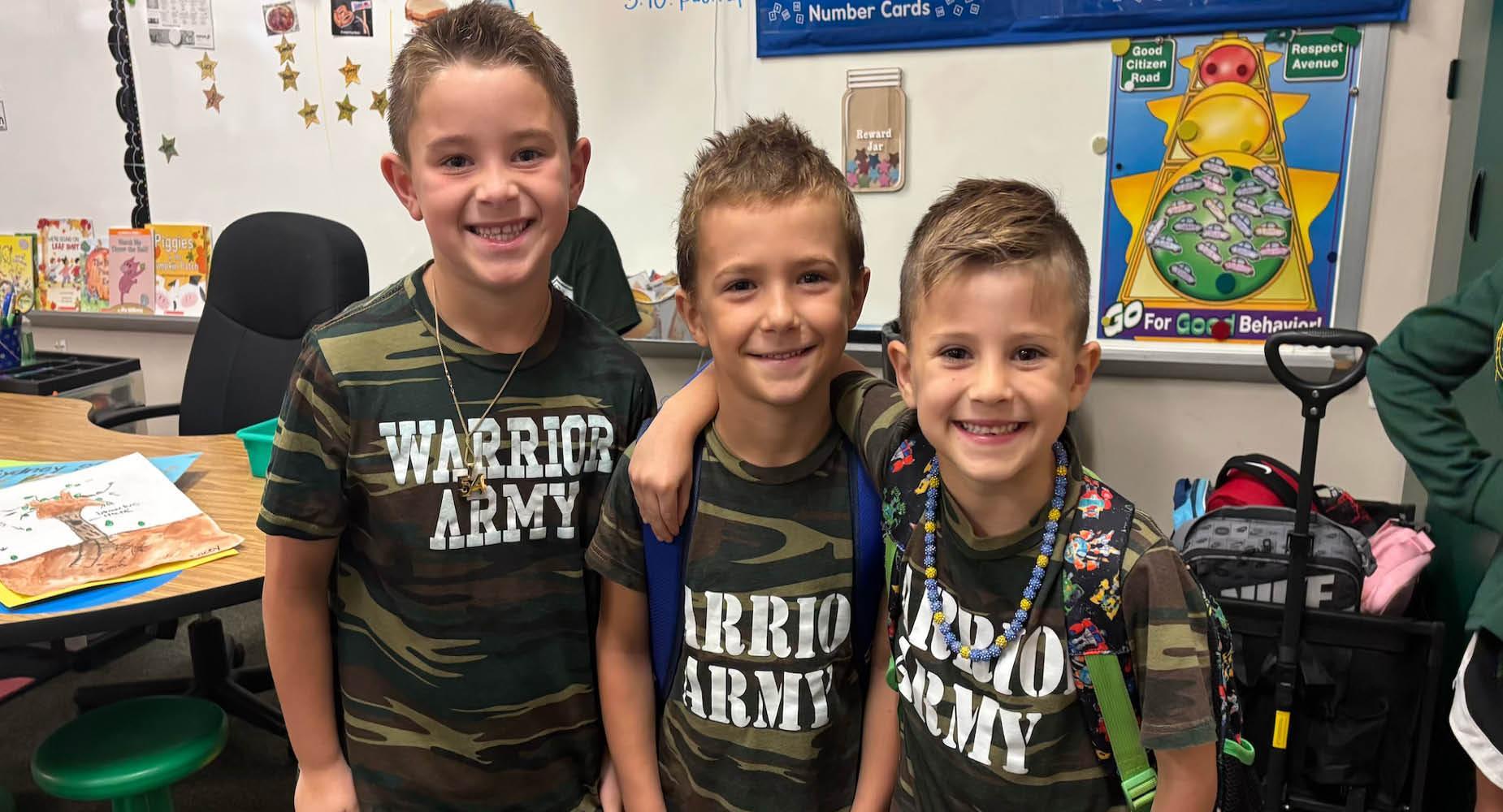 Level Green students Cooper Hornak (grade 1), John Duckworth (grade 1), and Abram Gaten (grade 2)
dress alike in camouflage during spirit week