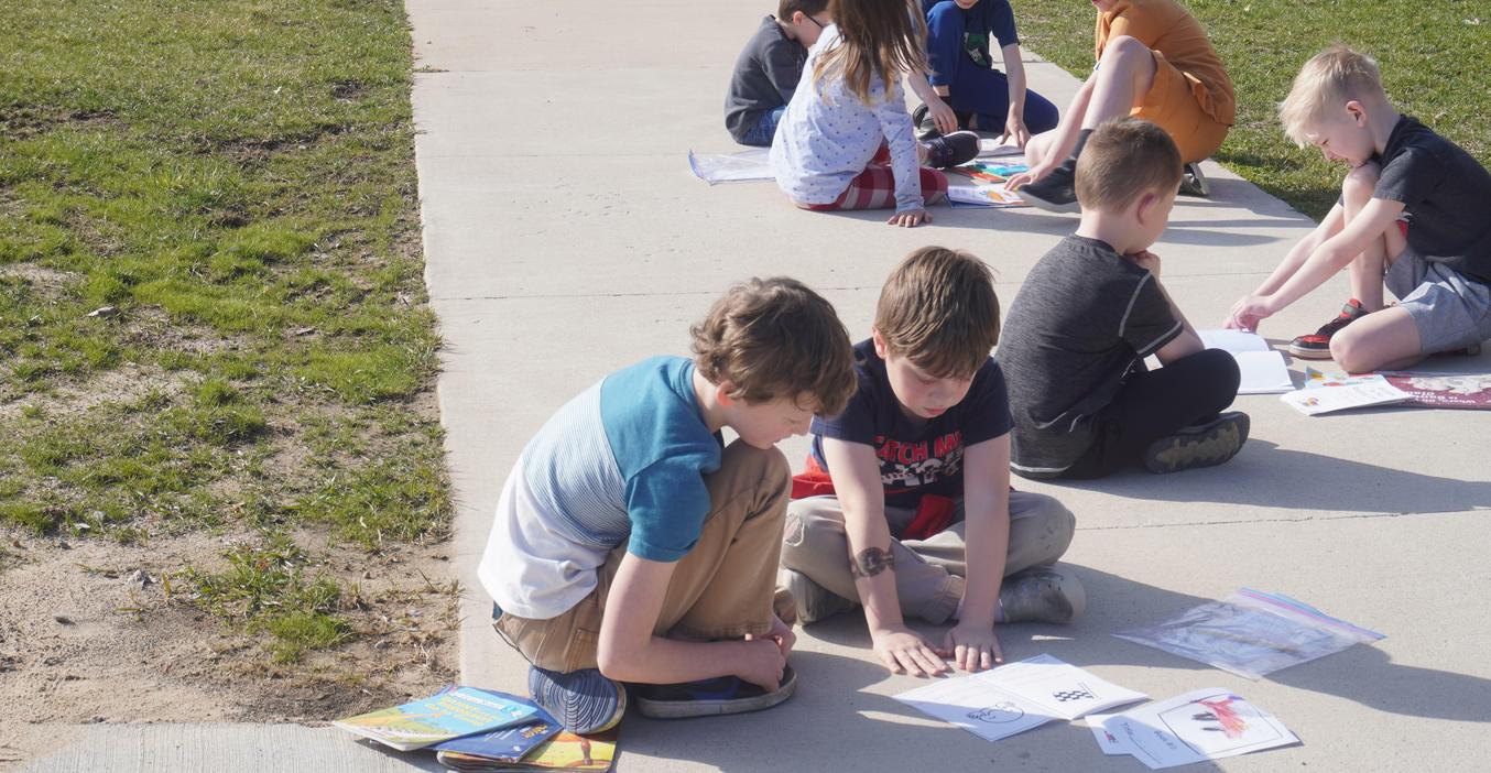 A Lee student reads with a McFall student.