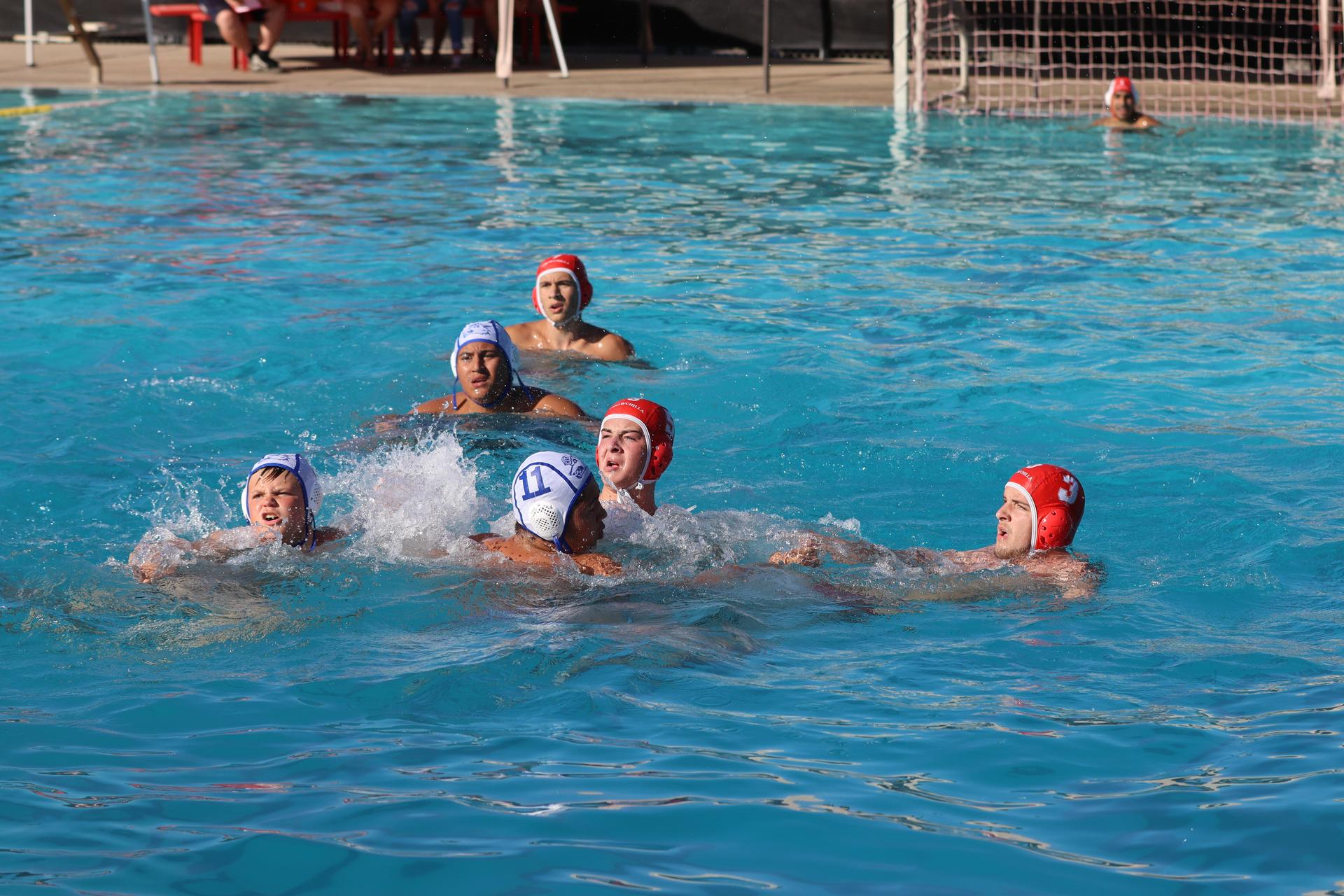 boys playing water polo against Madera
