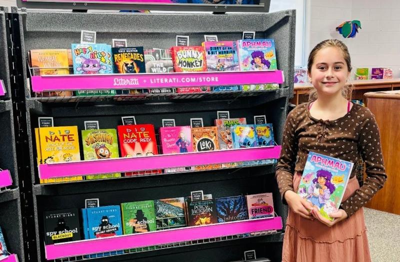 Book Fair display with student