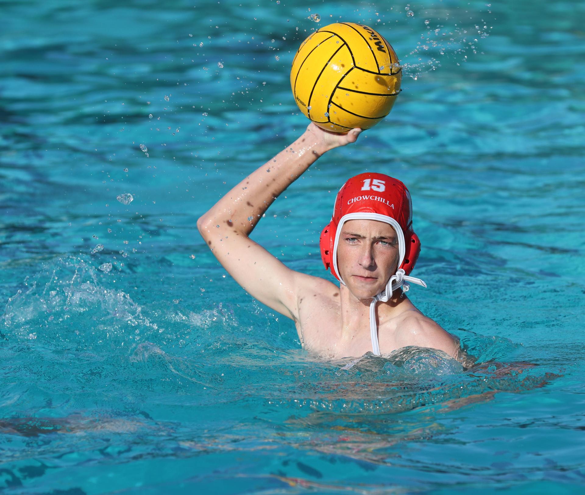 boys water polo players in action against san joaquin memorial