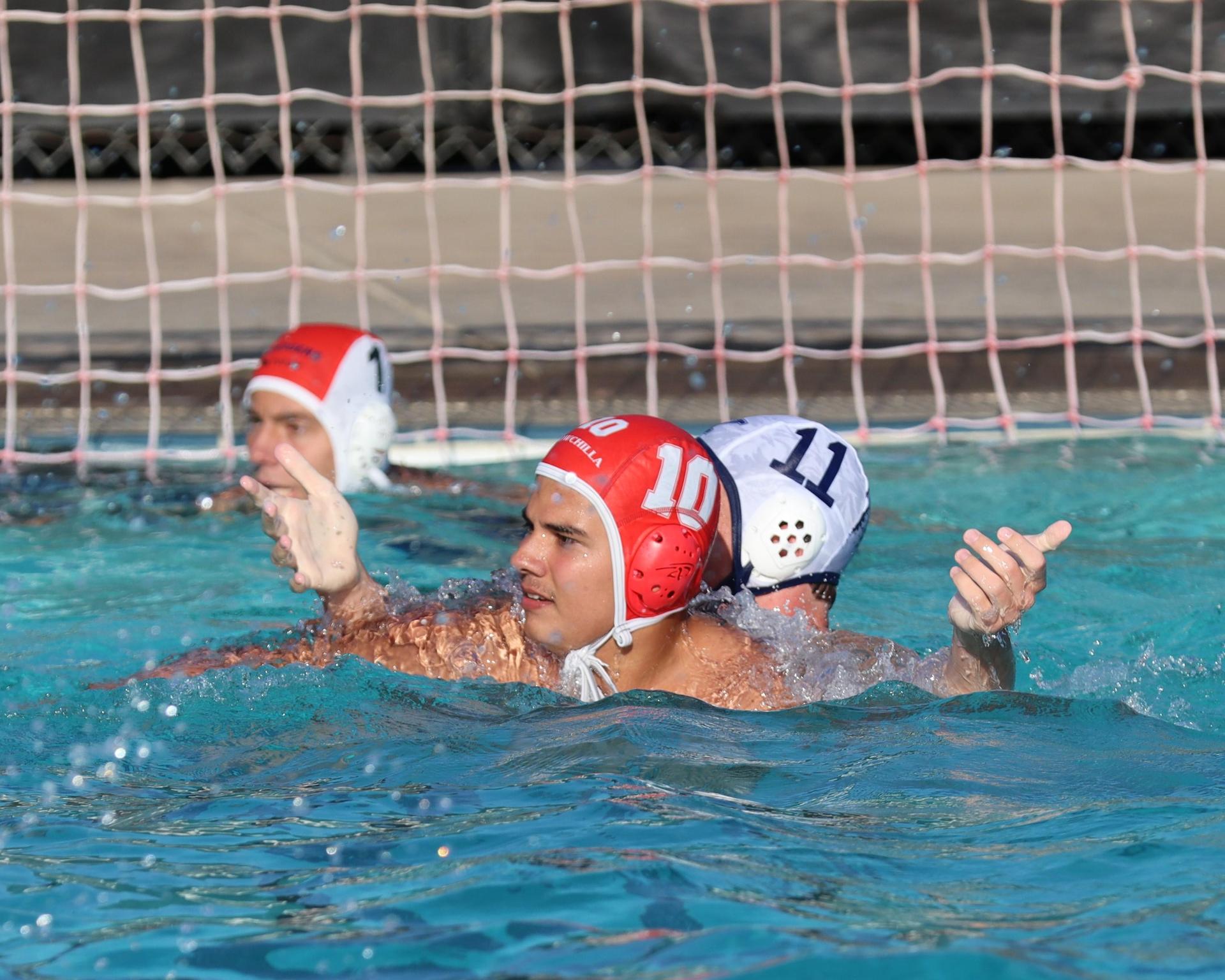 Boys playing water polo against Yosemite