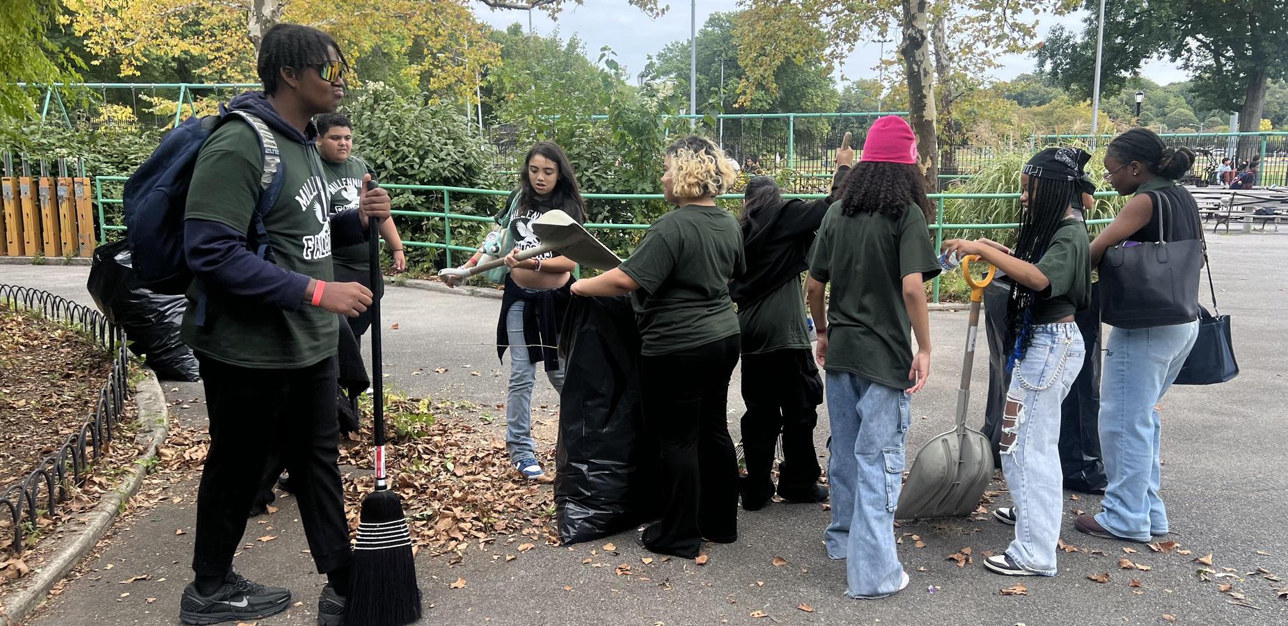 Students cleaning up Pelham Bay Park for community service day.