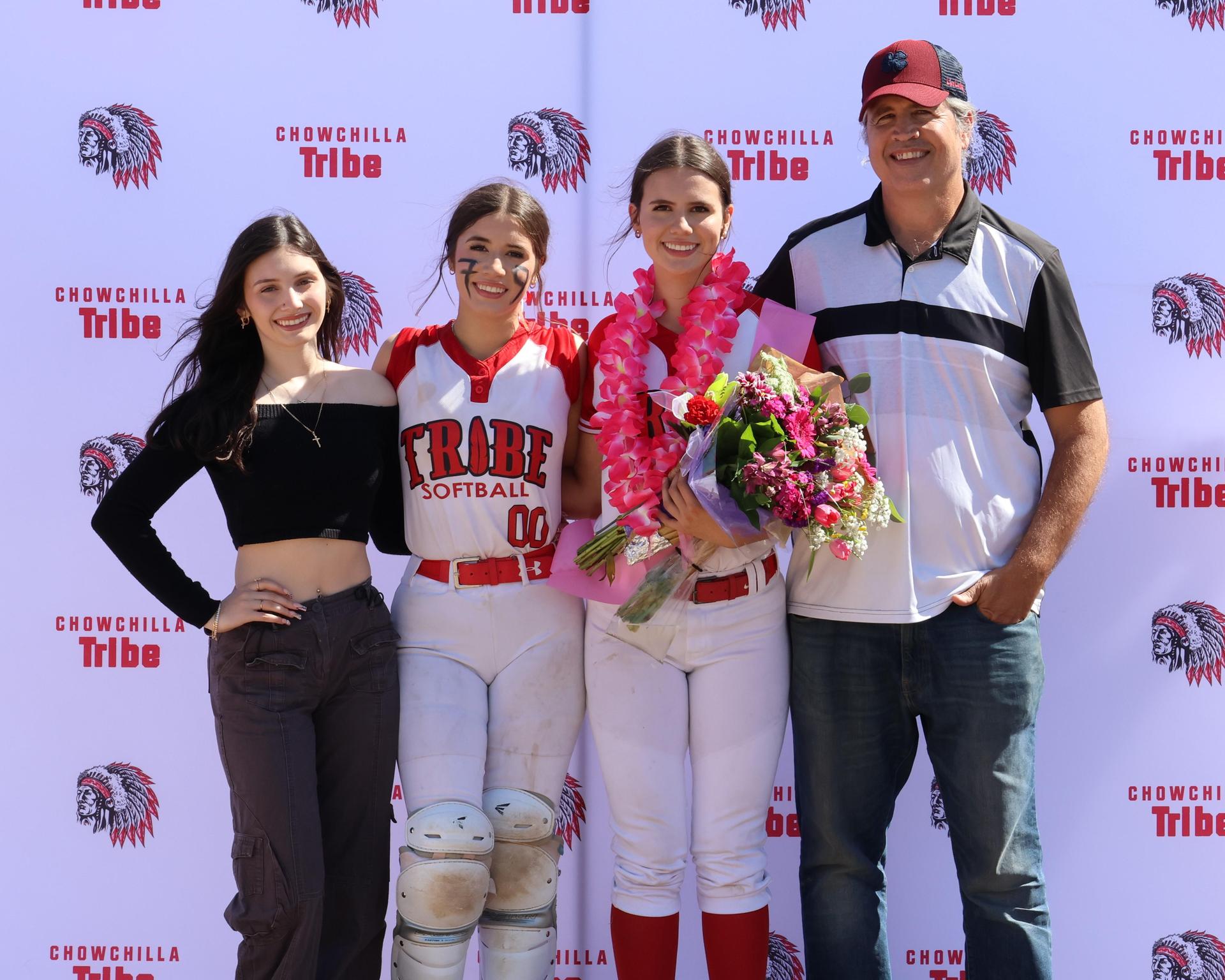 Seniors Posing With Teammates, Coaches, And Family