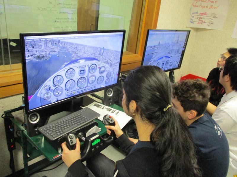 Kids playing with flight simulator