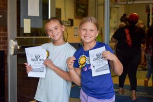 Students at South Elementary School welcome families to their campus’ Back-to-School Night session.