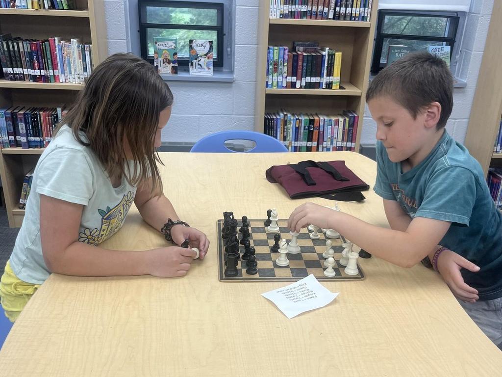 Two students playing chess.