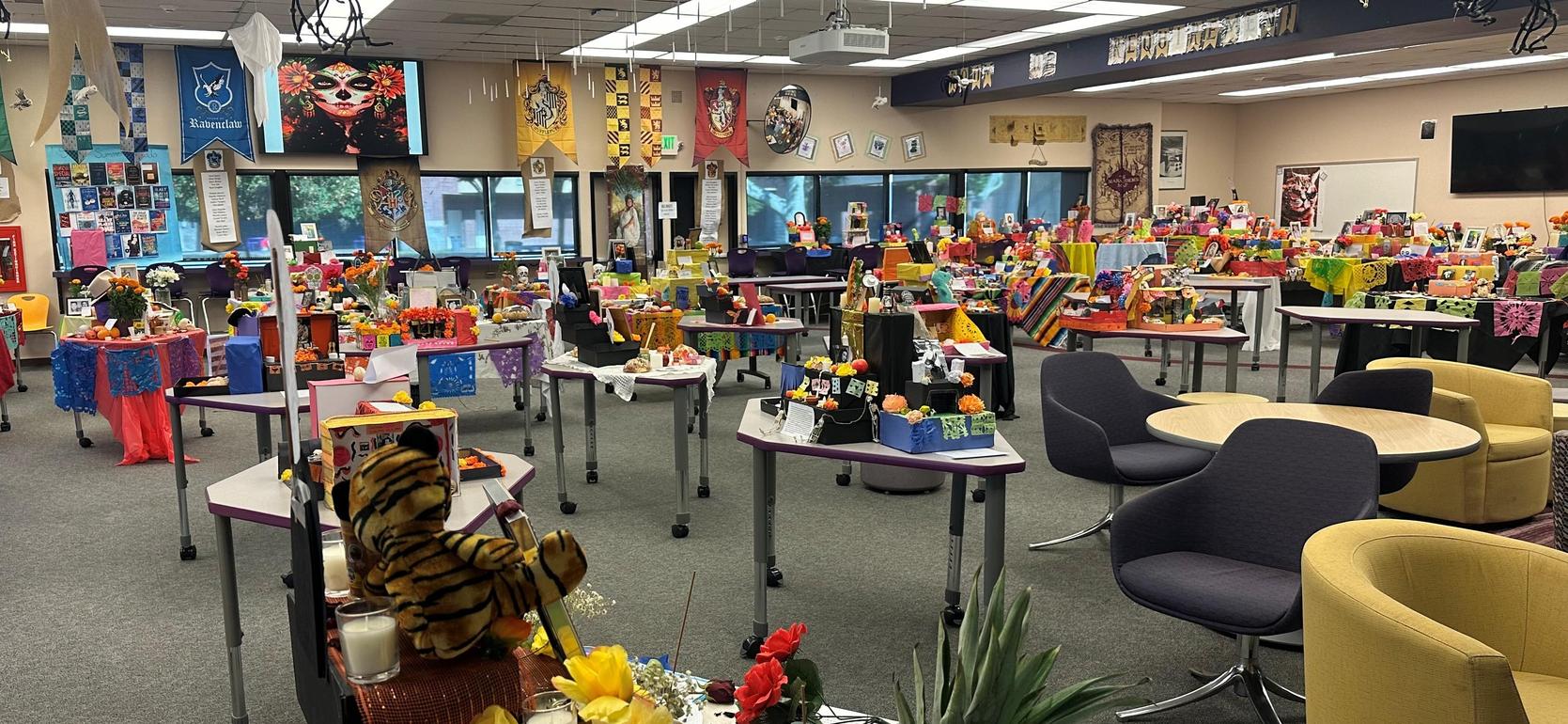 Classroom filled with colorful displays and decorations arranged for an event.