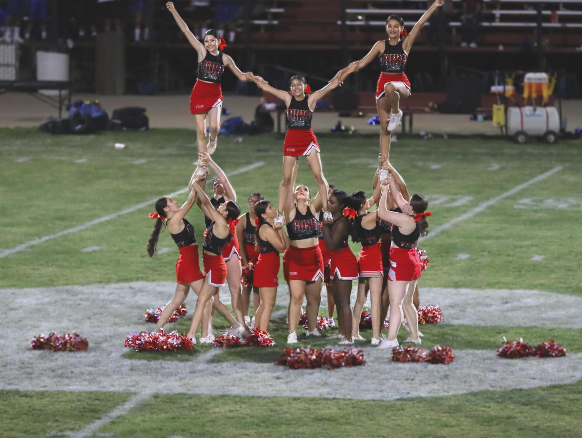 Varsity girls cheering at the Parlier football game