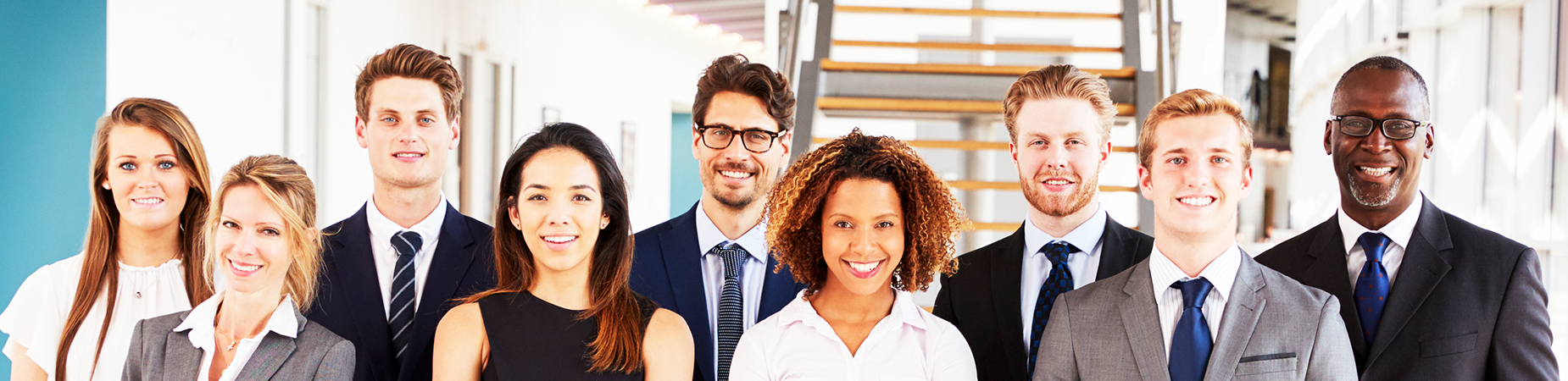 A diverse group of business people facing the camera.