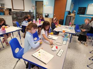 students working together to create a pomander