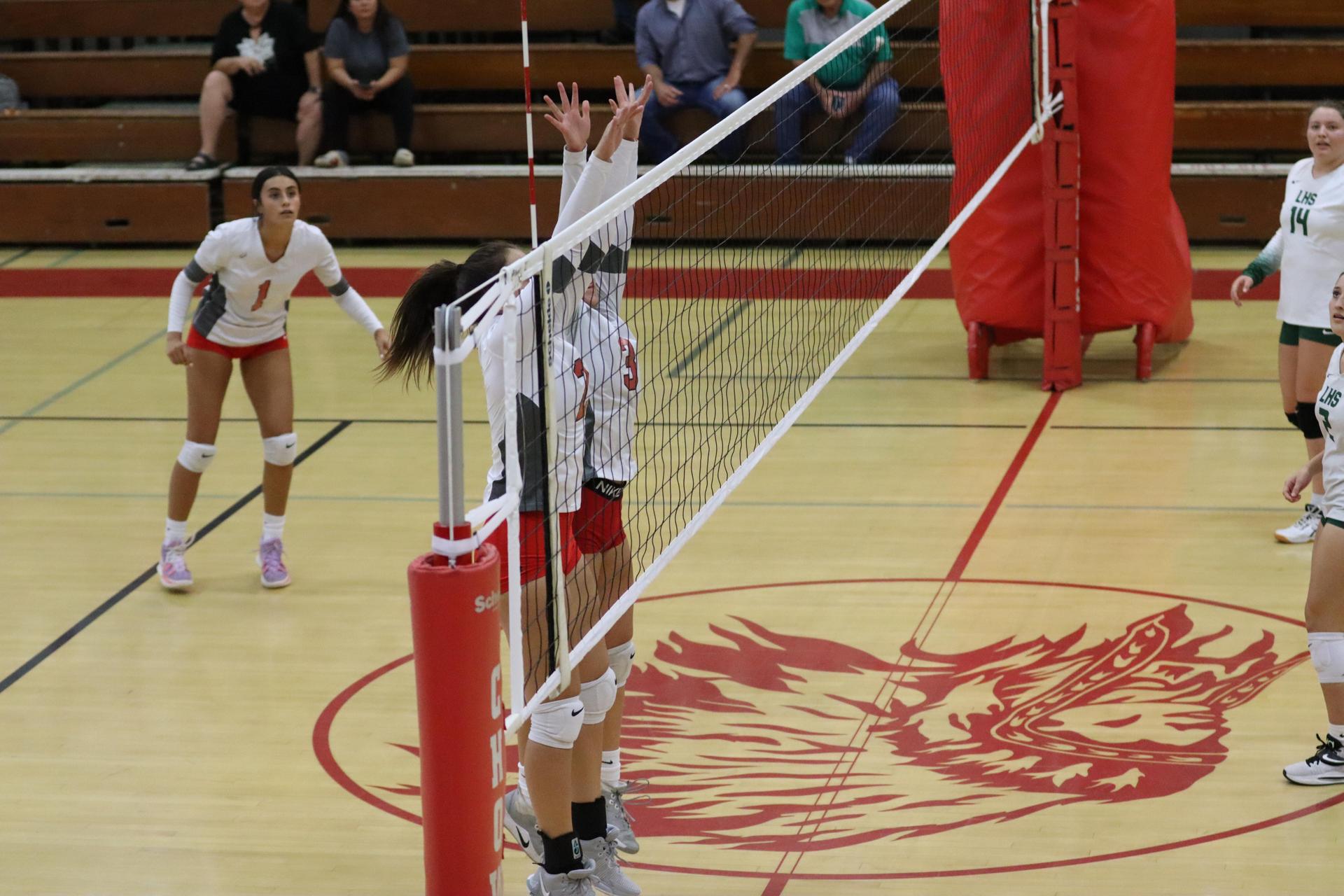 junior varsity girls playing volleyball against Liberty