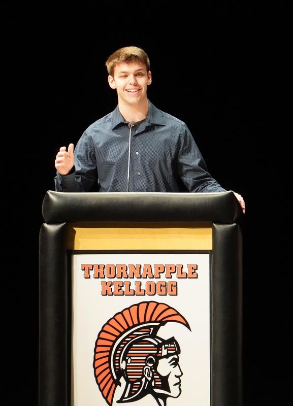 A student addresses guests at the NHS induction ceremony.