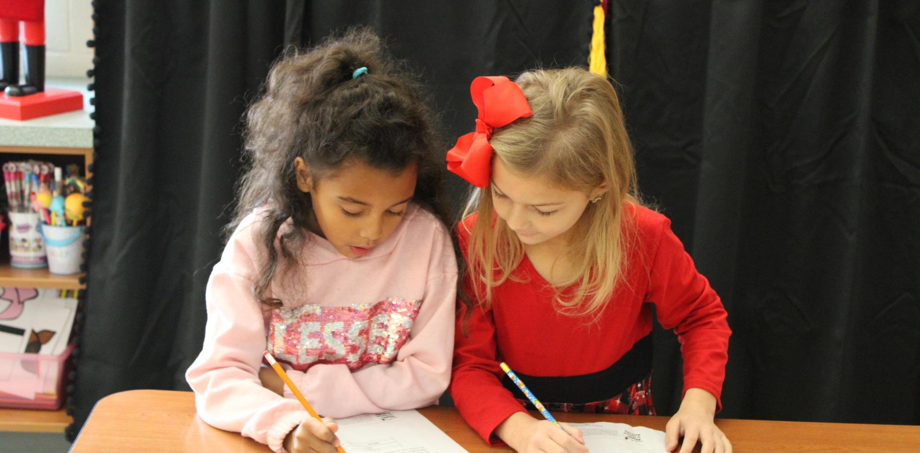 students working on math pages