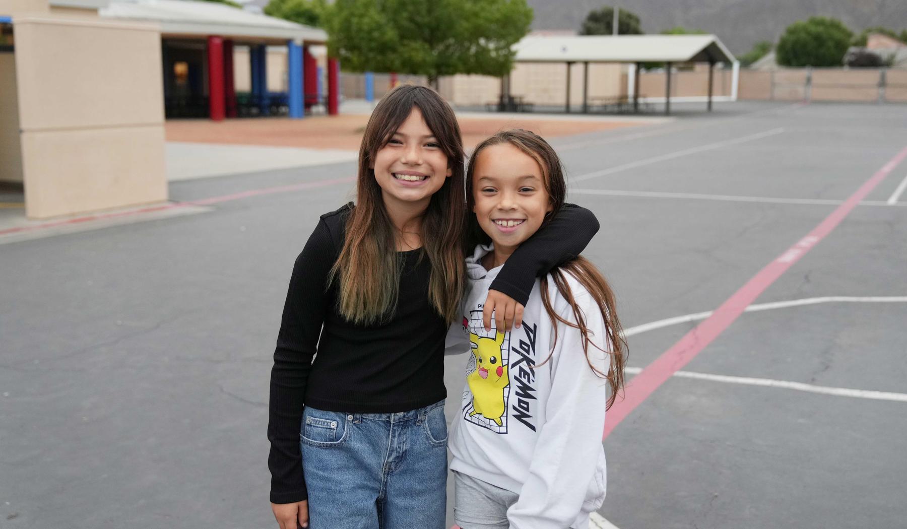 two smiling elementary girls
