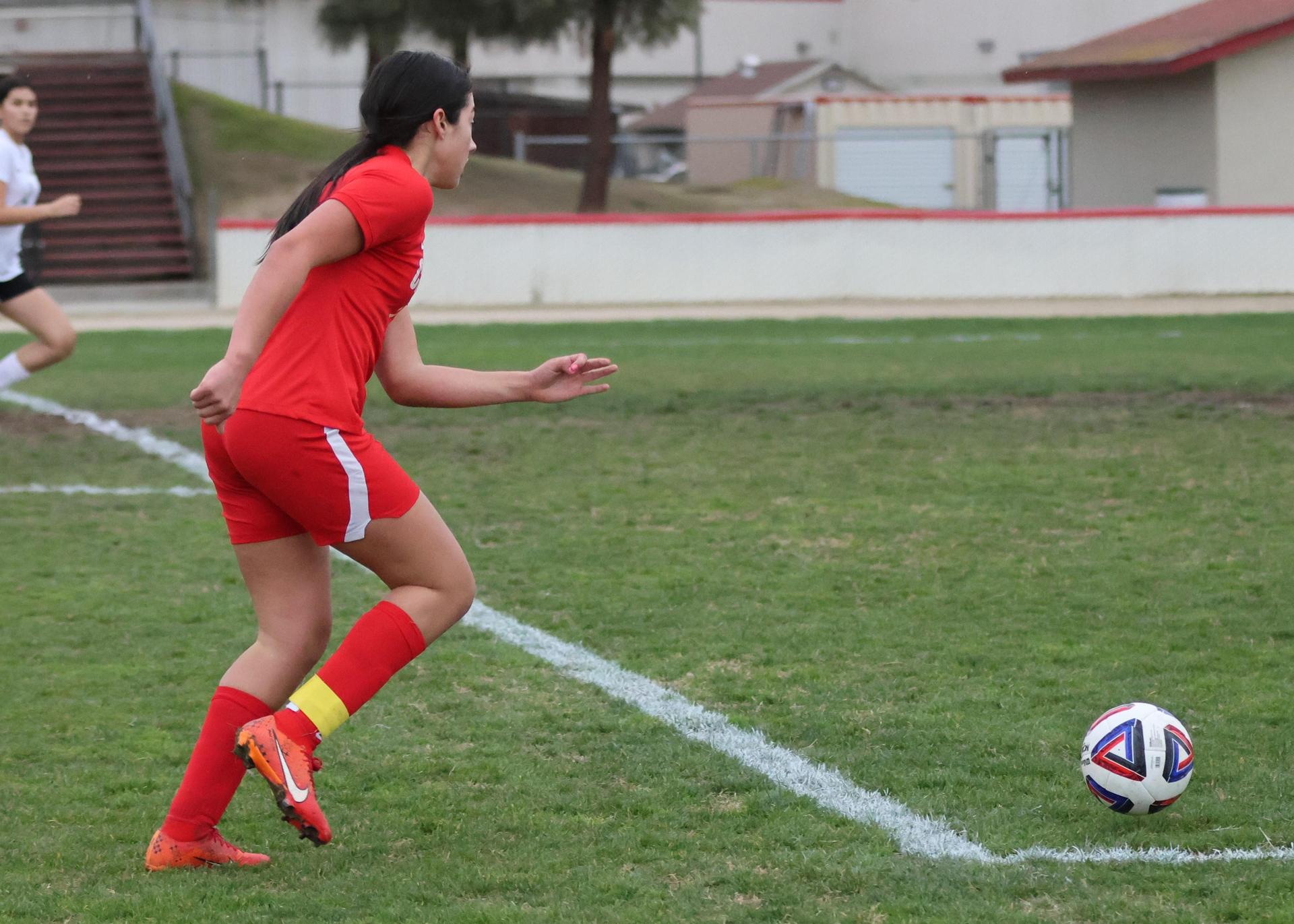 Junior varsity girls playing soccer against liberty