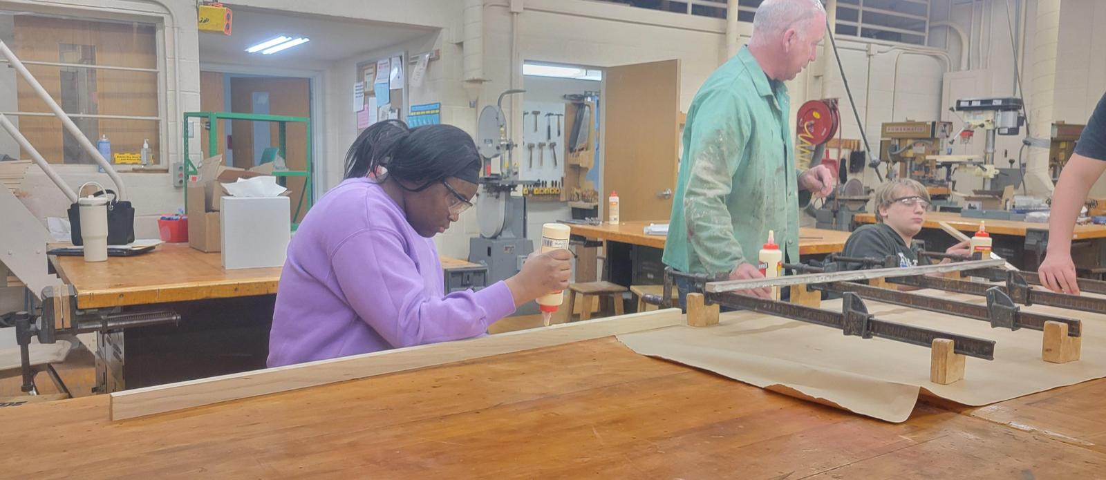Students working on cutting boards.